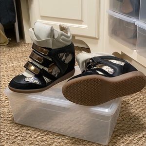 Isabel Marant Sneakers with snake skin and gold.